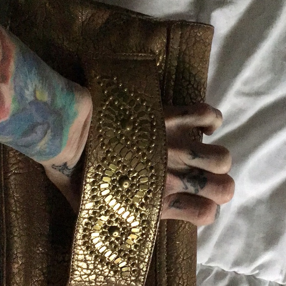 Calleen Cordero clutch. vintage brown with gold detail